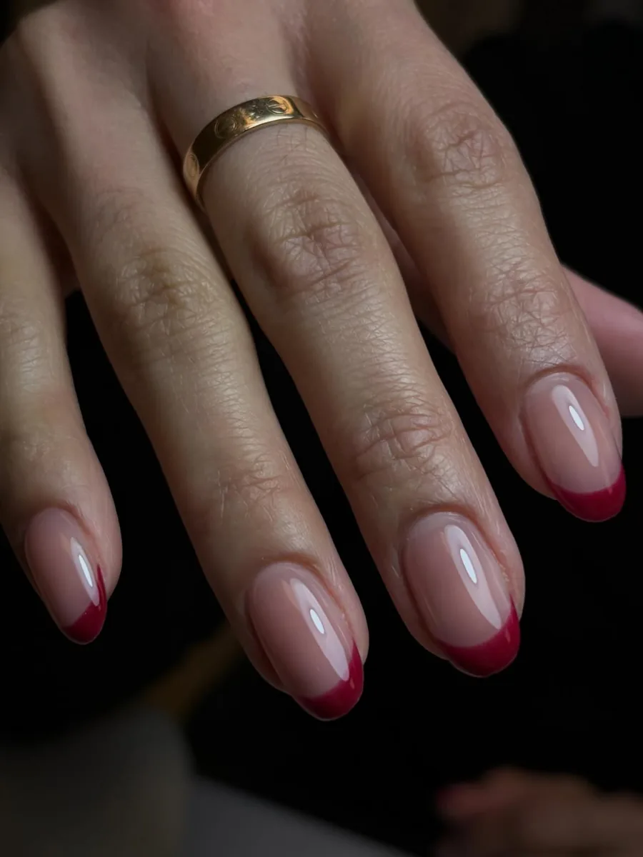 Nude nails with deep red French tips