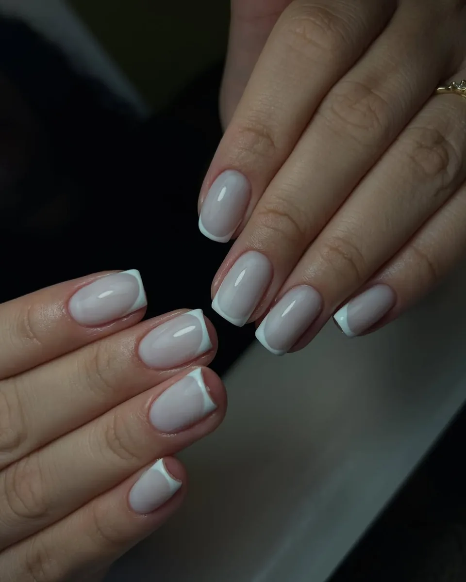 Short square nails with a white French tip